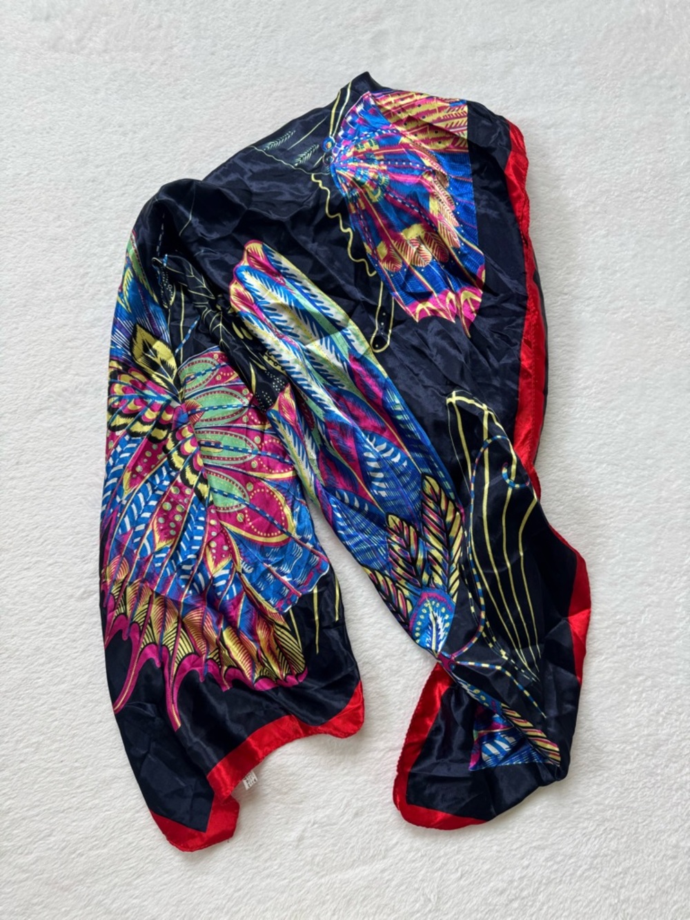 Vibrant Feather Print Scarf with Red Trim
